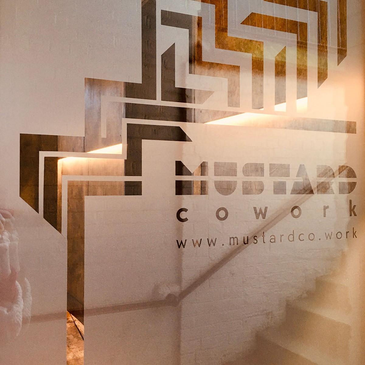 Mustard Coworking. Brand identity door vinyls close-up. By design agency Superfried. Manchester.