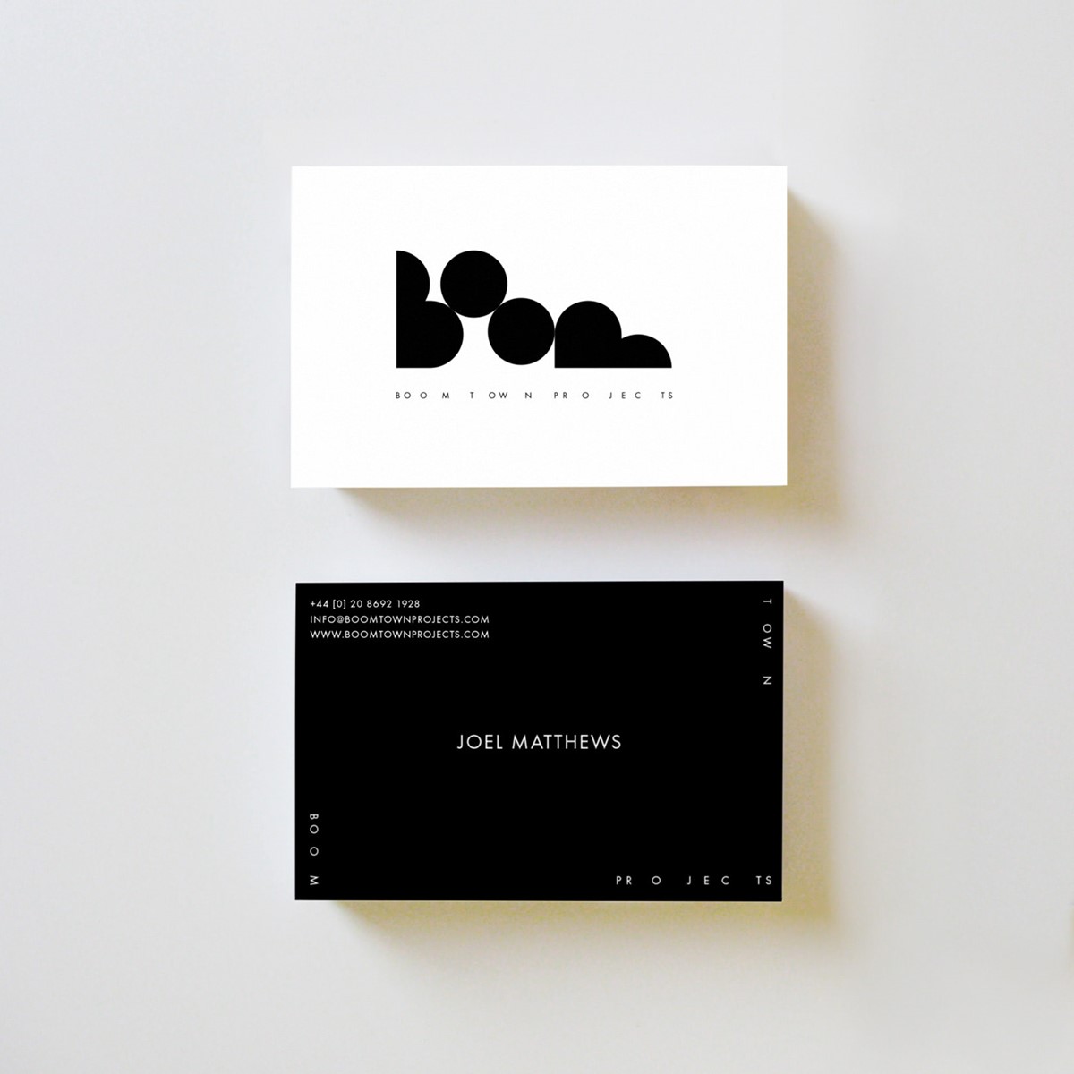 Boom Town Projects. Business cards mock up. Brand identity design by Superfried.