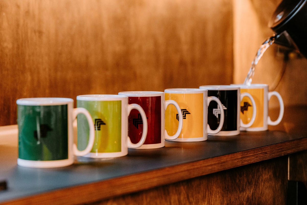 Mustard Coworking. Branded mugs. Identity design by Superfried. Manchester.
