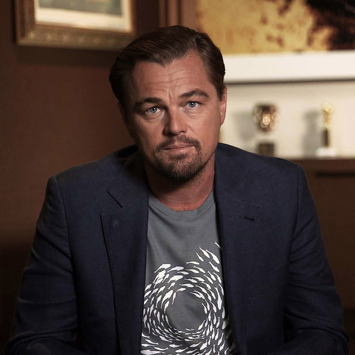 Leonardo DiCaprio wearing World Ocean Day t-shirt designed & illustrated by Superfried. 