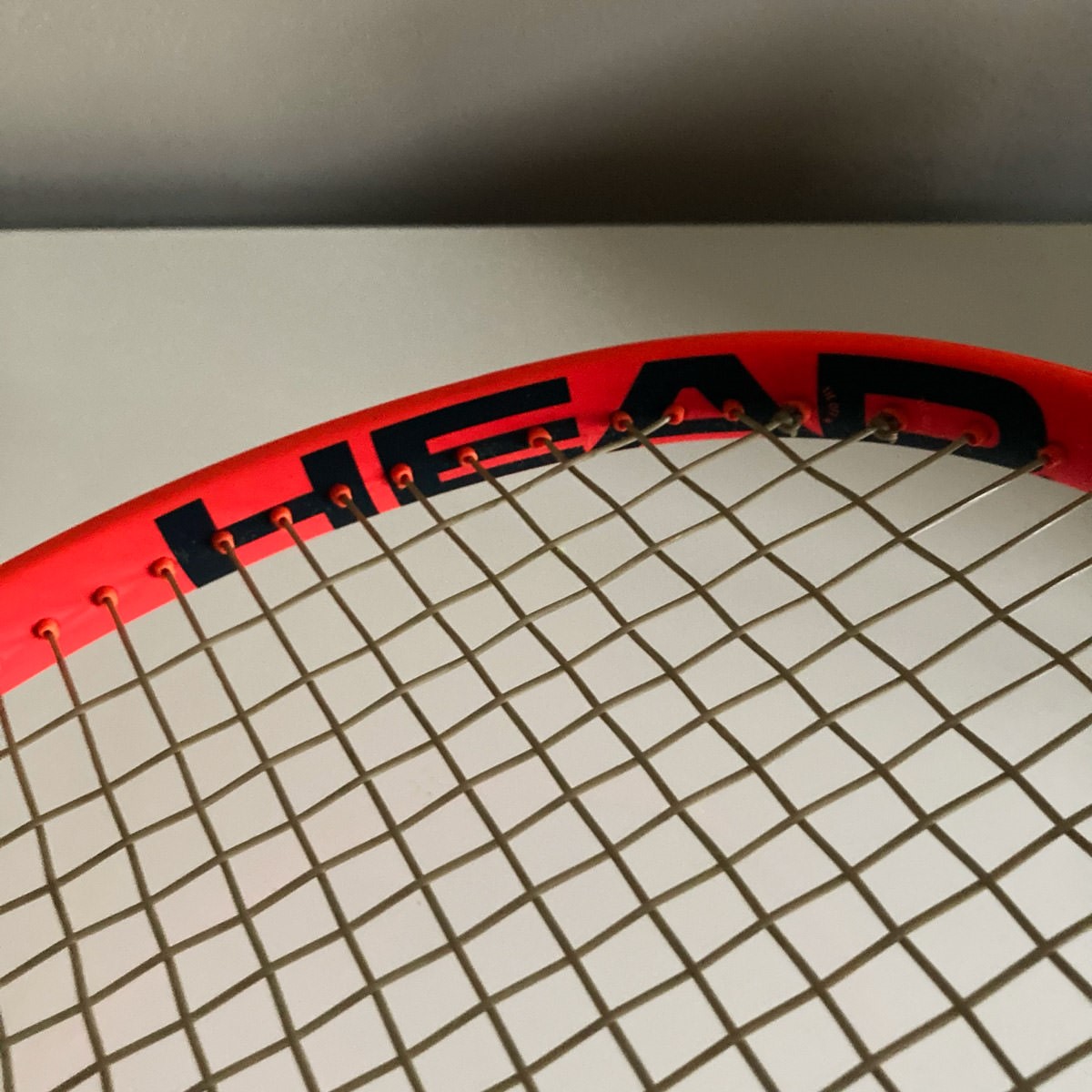 Superfried – Walk the Talk. Buying a tennis racket – Head Radical MP - strings close-up. Considering purchases to reducing my environmental impact. 