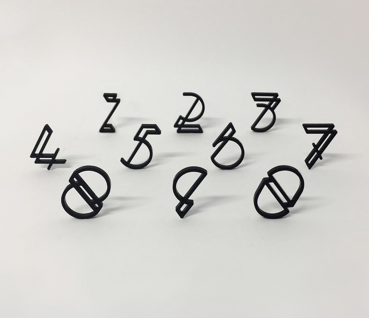 Flex. Fred Aldous. Experimental laser cut numerals standing. Typography design by Superfried.