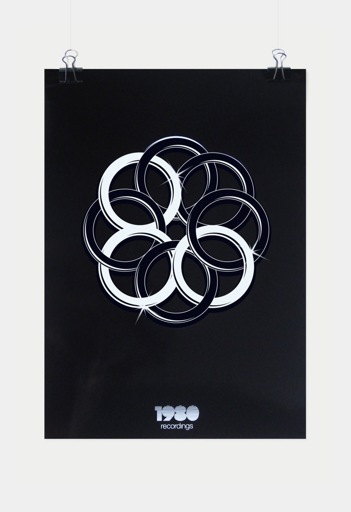 1980 Recordings. Interlocked shiny rings logo poster. Brand identity design by Superfried.